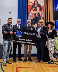 Group photo, L-R: Jaaji of Twin Flames, Chairman Wayne Daly, Principcal James Price, Director of Education Jennifer Dubeau, and Chelsey June of Twin Flames