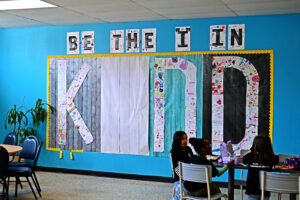 A giant "Be the I in Kind" mural in the cafeteria