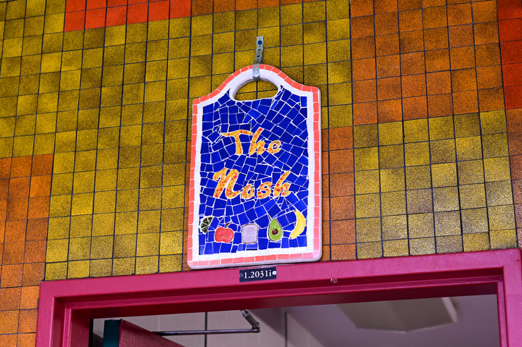 The Nosh sign above the door to the kitchen