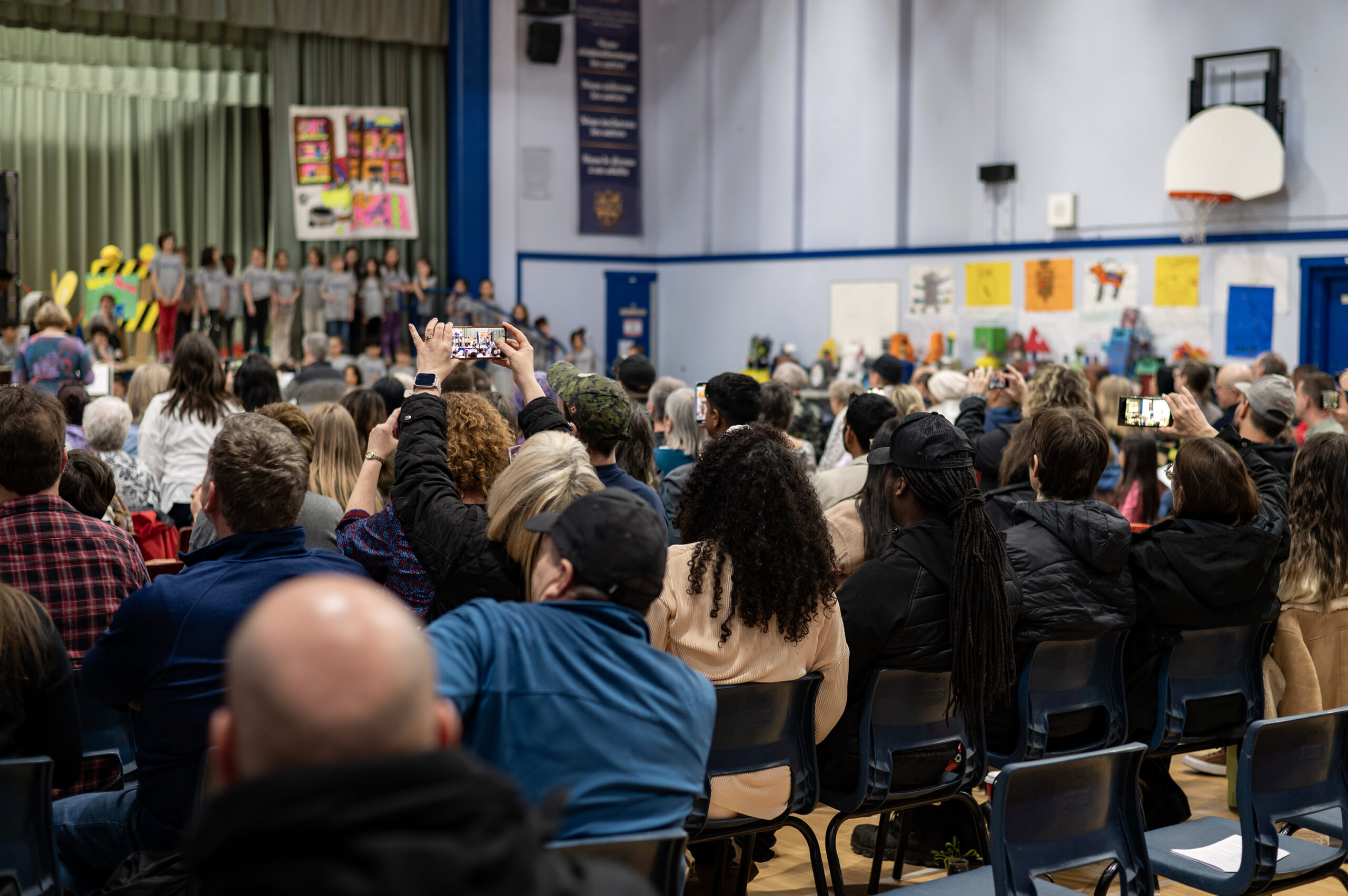 Proud parents recording during the second performance