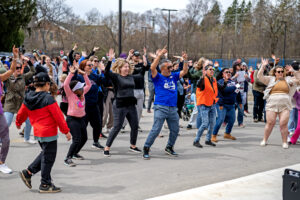 Attendees enthusiastically participating in the Zumba class