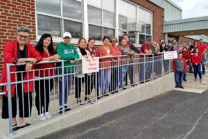 Red Dress Day at Pontiac Continuing Education Centre, students and staff stand outside their centre